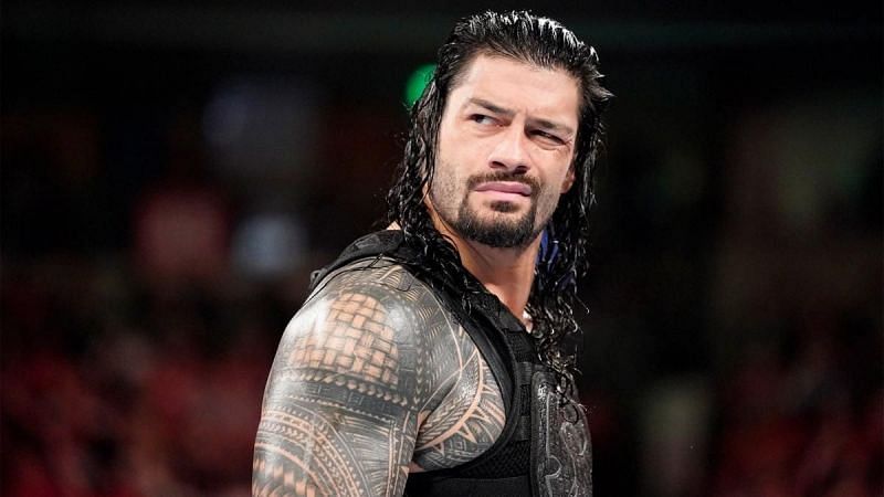 Reigns was not amused at Mike Rome's announcement for Shane McMahon